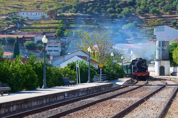 Fototapeta na wymiar Train coming to the station at Pinhao in Douro Valley, Portugal