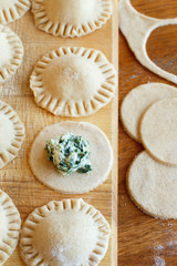 Making ravioli with ricotta cheese and spinach