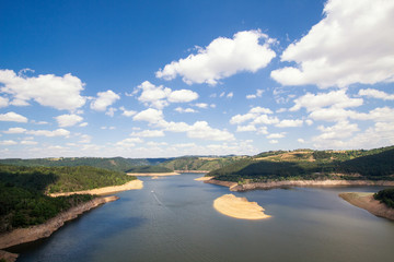 Wide view over a partly drained Gorges de la Truyere in Val d´Arcomie, Cantal, France. Partly drained for the maintenance of one of it turbines further down the river. 