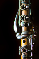 Detail of Antique clarinet on a black background