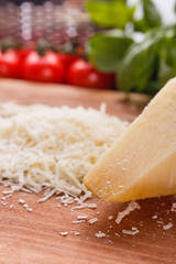 fragrant grated Parmesan on a wooden slicing board