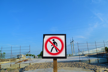 Sign of the prohibition of human passage on the bridge near nature.