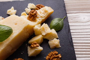 fragrant Parmesan on a slate stone slicing board