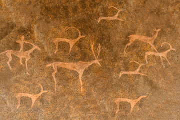 image of ancient animals, hunter on the cave wall. archaeology. history.