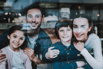Young Beautiful Family Portrait in Cafe