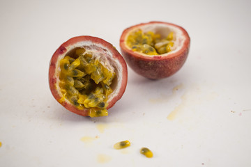 Two half of passion fruit sliced. Halfs of maracuya isolated on white background