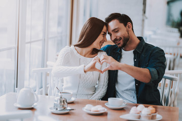 Young Couple is Resting in Cafe