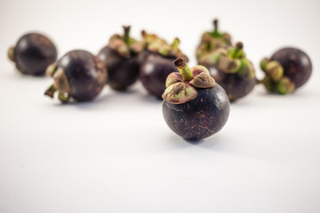 Mangosteens isolated on white background
