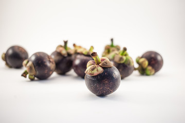 Mangosteens isolated on white background