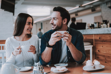 Young Couple is Resting in Cafe