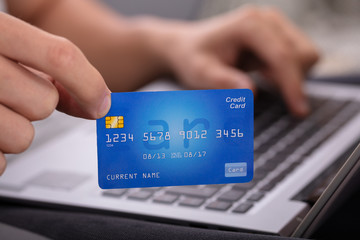 Close-up Of A Man's Hand Holding Credit Card
