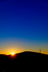 Silhouetted Hill at Sunrise