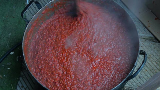 Cooking Red Peppers, Eggplant and Tomatoes. A Bulgarian Traditional Dish Called Liutenitsa