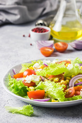 Tomato goat cheese corn salad with olive oil mustard vinaigrette. Selective focus, space for text.