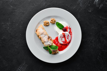 Apple Strudel with Ice Cream and Nuts. Free space for your text. Top view.