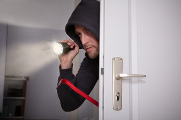 Thief Peeking From Door