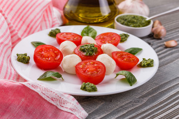 Caprese salad on a wooden rustic background