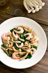 White beech mushrooms with leaves of spinach and shrimps