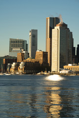 Obraz premium Sunrise on the architecture and waterfront of the urban city skyline of Boston MA
