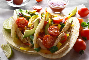 Tacos with chicken meat and vegetables