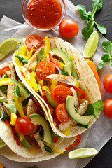 Tacos with chicken meat and vegetables