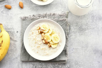 Oats porridge with banana slices and nuts