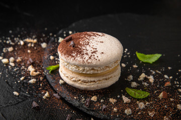 French Colorful Macarons on Black Background Horizontal Close Up