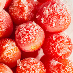 Frozen tomatoes covered with hoarfrost. close-up.