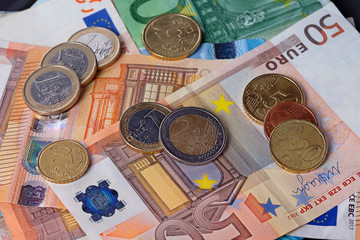 A lot of money with euro bills and coins