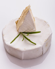 delicious creamy camembert cheese on a white background