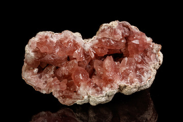 Macro mineral stone Pink Amethyst on a black background