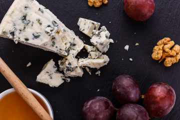 delicious blue cheese on wooden rustic background