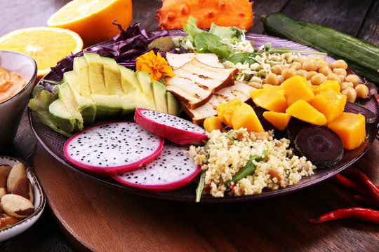 grilled tofu and dragon fruit buddha bowl with vegetable and humus