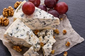 delicious blue cheese on wooden rustic background