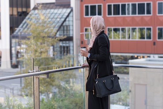 Woman standing in balcony