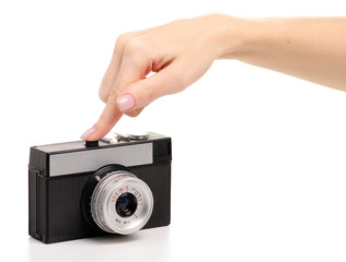 Fototapeta premium Old photo camera in hand on white background isolation