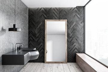 Black wood and concrete bathroom, sink and mirror