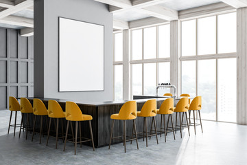 Gray bar corner, yellow chairs and poster