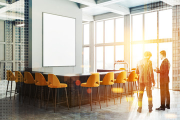 Gray bar corner, yellow chairs and poster, men