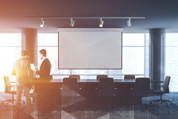 Office meeting room with poster, people