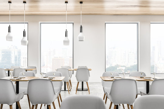 White loft cafe interior, tables