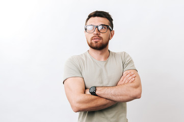 Fototapeta premium Middle age man looking apart with crossed hands