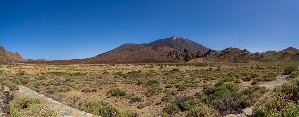 Panoramic view of the lava fields of Las Canadas caldera of Teide volcano. Tenerife. Canary Islands. Spain. View from the observation deck - "Mirador Boca Tauce".