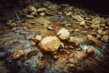 Obraz premium stones in the water stream