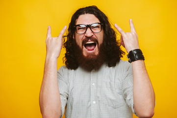 Photo of screaming bearded man wth glasess