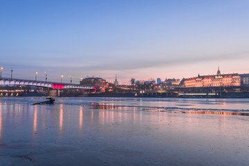 Fototapeta na wymiar Warsaw skyline with reflection in the Vistula river at the evening