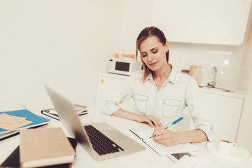 Woman Is Making Notes. Work From Home Concept.