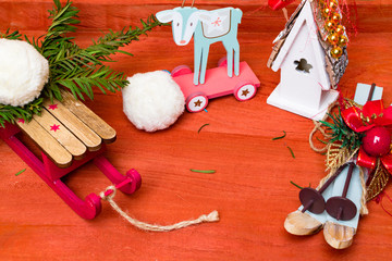 Christmas background with tree on sledges. ski, house on wooden table