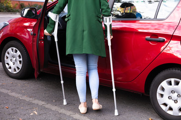 Disabled Woman Opening Door Of A Car