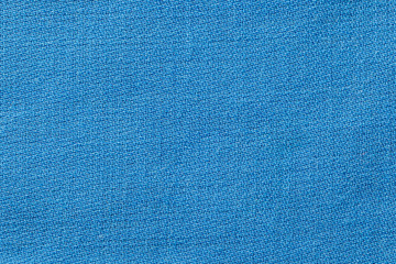 Blue linen fabric of cloth texture background. Detail of textile material close-up.